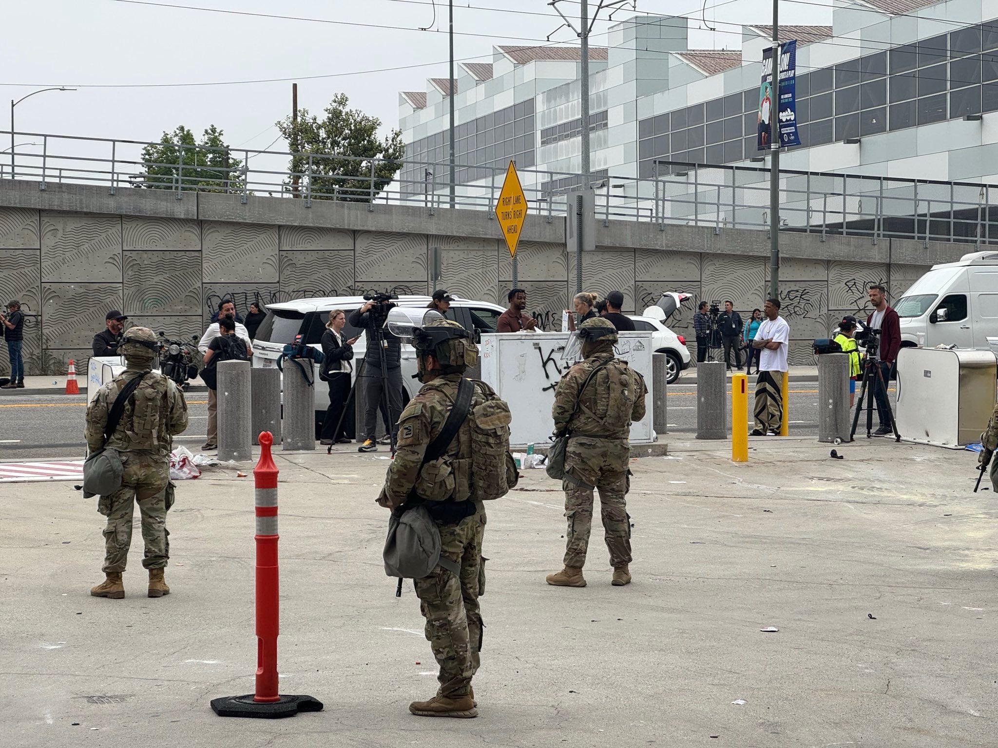 Members of the California National Guard posted outside of the Federal Building in Downtown Los Angeles in front of members of the press.